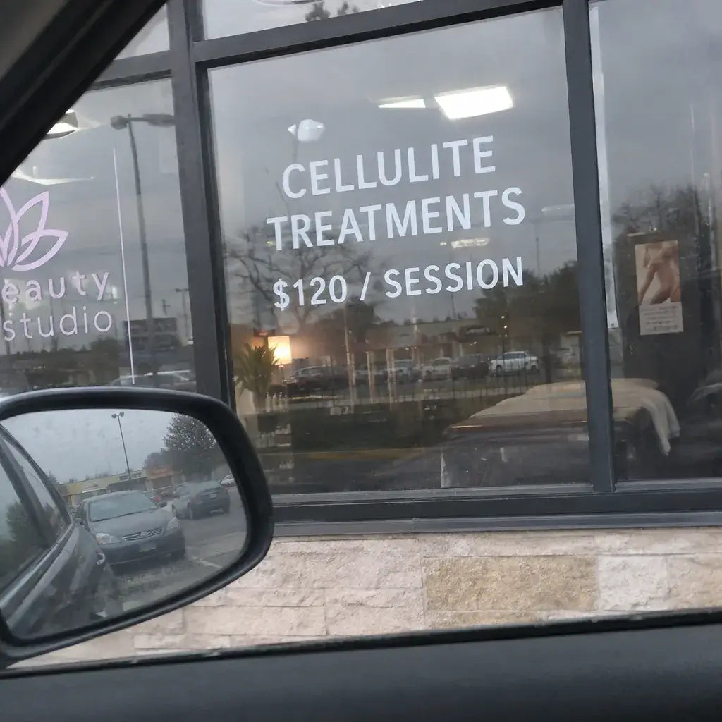 A strip mall cellulite studio window advertising $120 sessions and packages